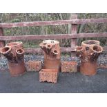 A set of three terracotta Planters moulded as a tree trunk, 2ft H, and a set of three rectangular