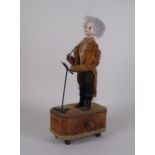 A 19th Century Musical Automaton in the form of a conductor having moving head and arm, bisque