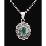 An Emerald and Diamond Cluster Pendant claw-set oval-cut emerald within a frame of brilliant-cut