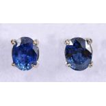 A pair of Ceylon Sapphire Ear Studs, each claw-set oval-cut stone, total sapphire weight 3.04cts, in