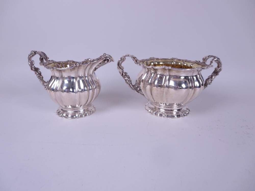 A George IV silver two-handled Sugar Bowl and Milk Jug with gilt interiors, finely decorated fruit