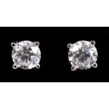 A pair of Diamond Ear Studs each claw-set brilliant-cut stone, total diamond weight 0.94cts, in 18ct