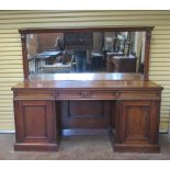 A Victorian mahogany Sideboard with raised mirror back, the base fitted three drawers above pair