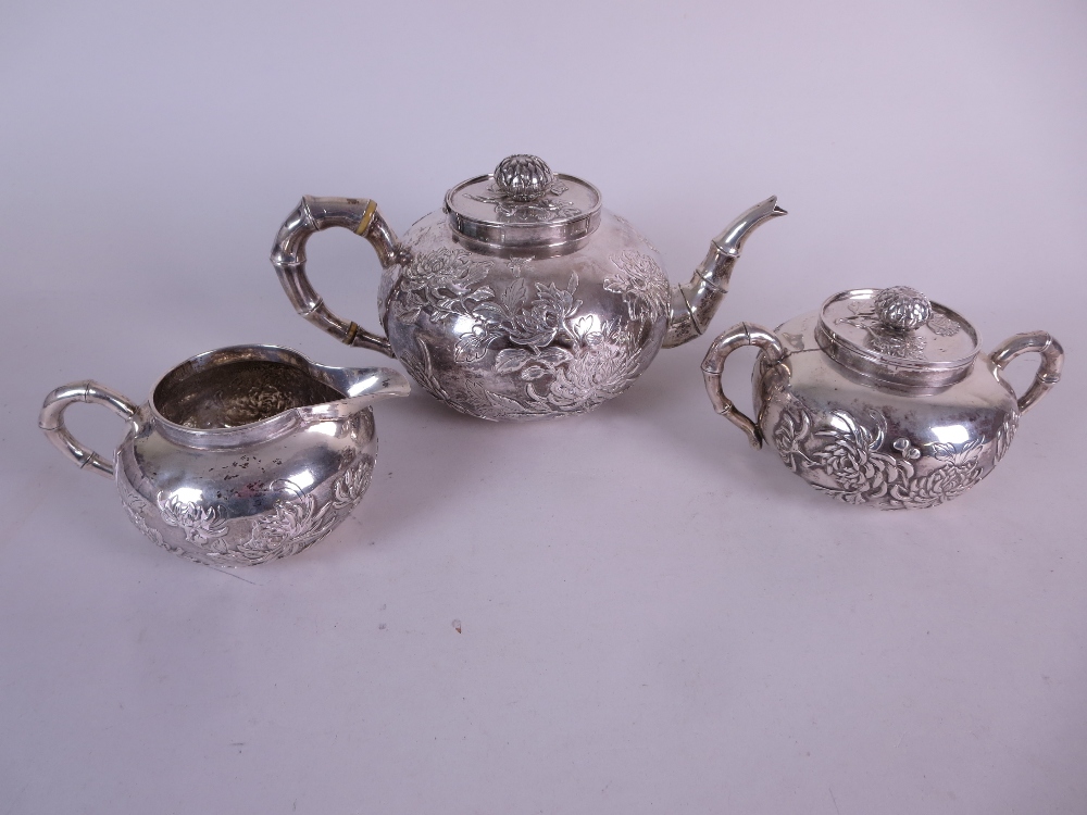 A Chinese silver three piece Tea Service decorated insects and chrysanthemum, the teapot and sucrier - Image 5 of 10