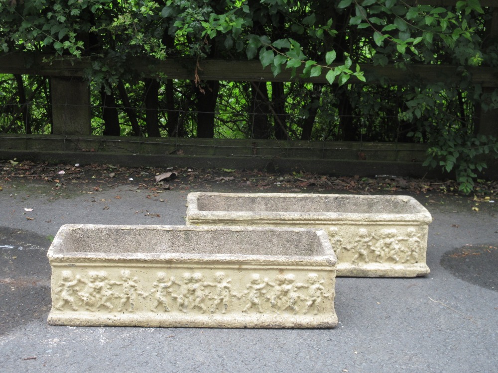 A pair of rectangular Garden Planters with frieze of putti, 2ft 2in L