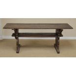 A 17th Century oak small Refectory Table with thick plank top and under tier, on shape trestle