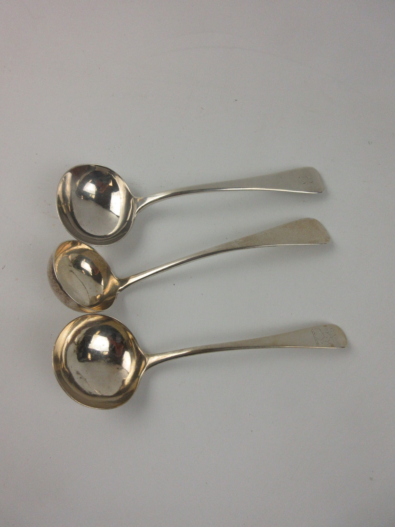 Three silver Sauce Ladles, old english pattern, London circa 1770 and 1824, and Glasgow 1852