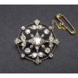 A Victorian Diamond Brooch the circular openwork plaque claw and pavé-set throughout old and rose-