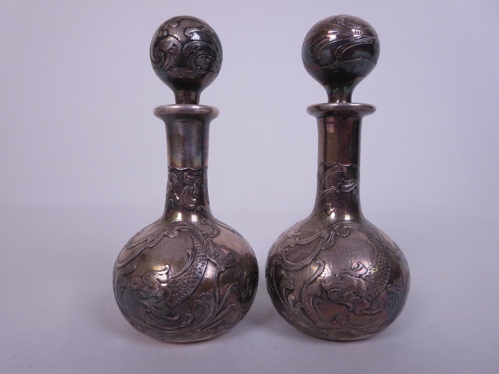 A pair of Art Nouveau small silver overlaid Scent Bottles and Stoppers of club shape with dolphin - Image 2 of 5