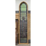 A 19th Century stained glass Church Window of St John, in oak frame, 11ft 6in H x 2ft 6in W