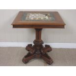 A Victorian walnut Games Table with marble top mounted upon turned column and four supports, (A/