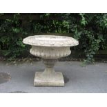 A composition pedestal Garden Urn with egg and dart border, 2ft 1in diam