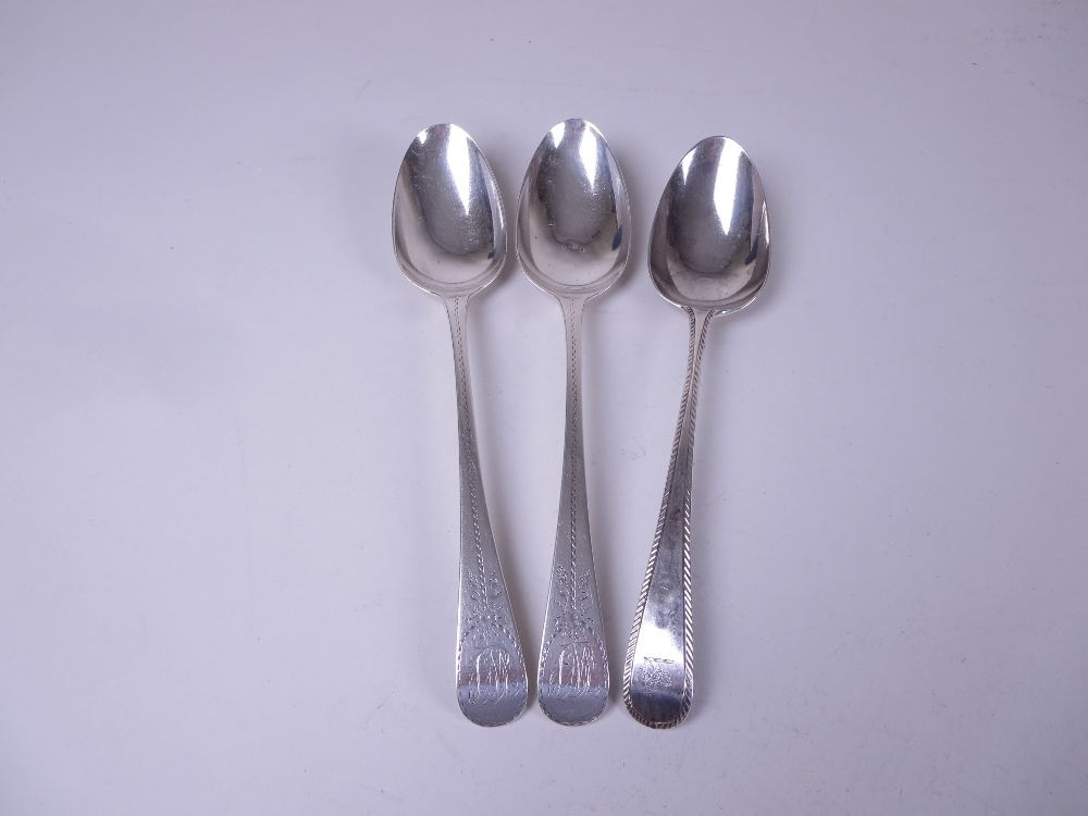 A pair of George III silver Table Spoons old english pattern with bright cut decoration and