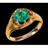 An Emerald single stone Ring claw-set round stone in engraved mount, ring size N