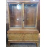 An Art Deco walnut Vitrine with pair of plain glazed doors above pair of solid doors