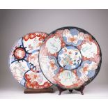 Two Japanese Imari Chargers, Meiji Period, one decorated with panels of birds, scholars and