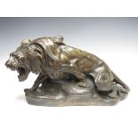 After Thomas Cartier. A bronzed terracotta Model of a roaring Lion on rocky base, signed T. Cartier,