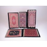 A collection of five miniature Persian Carpets, realistically woven, some with fringes, probably