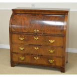 A 19th Century mahogany Cylinder Desk enclosing inset red leather writing surfce, numerous small