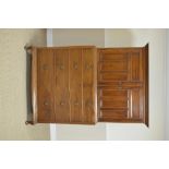 An Edwardian mahogany Linen Press with pair of multi-panel doors enclosing shelves, two short and