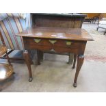 An 18th Century oak Side Table fitted single drawer above shaped frieze on four cabriole legs, 2ft