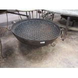 *An iron Kadai on round bar low Stand with a pair of Grills 1ft 11 1/2 in D (Sold plus VAT)