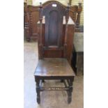 A 17th Century oak Side Chair with shaped top rail, plain arch panel back, solid seat on baluster