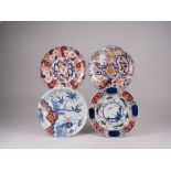 Four Japanese Imari Dishes, Meiji Period, of fan, kiku and cusped shape, floral and landscape