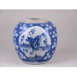 A Chinese blue and white Jar, Kangxi, painted with three quatrefoil cartouches of mythical beasts,
