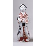A Japanese Imari figure of a Bijin, Edo Period, standing facing ahead with one hand holding a