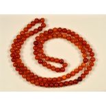 A long Amber bead Necklace, approx 125gms