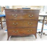 A Georgian mahogany and satinwood strung Chest fitted brushing slide above three graduated drawers