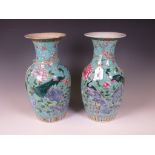 A pair of Chinese famille rose porcelain "Double Peacock" Vases, 19th/20th Century, decorated with a