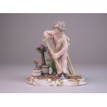 A Meissen porcelain Figure of a Gardener, mid 19th Century, modelled as a cherub digging with a