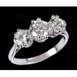 A Diamond three stone Ring claw-set graduated old-cut stones, estimated total diamond weight 1.