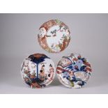 Three Japanese Imari cusped Dishes, Meiji Period, variously decorated with bijin, tsuru and kiku