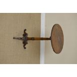 An early 19th Century mahogany tilt-top Table in the manner of George Bullock, with gun barrel and