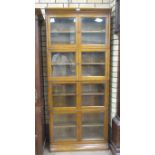 A Globe Wernicke four tier Bookcase with four pairs of glazed doors, 2ft 10in