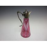 An EP mounted cranberry glass Claret Jug with opaque white decoration