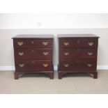 Pair of Georgian mahogany Chests of Drawers, each having moulded top, brushing slide and fitted