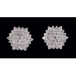 A pair of Diamond hexagonal Cluster Earrings each peg-set numerous brilliant-cut stones, stamped