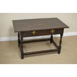 A 17th Century oak Side Table with cleated plank top fitted frieze drawer with brass swan neck