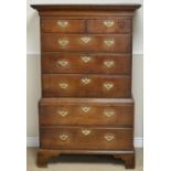 A George III oak Chest on Chest of small proportions fitted two short and five long drawers with