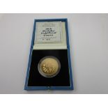 A Queen Mother gold proof Five Pounds 1990, in case of issue with COA