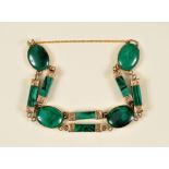 A 19th Century Malachite Bracelet set oval and baton shaped links in yellow metal engraved mounts