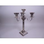 A plated three branch, four light Candelabrum on fluted column with swag, beaded and corinthian