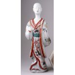 A large Japanese Imari figure of a Gentleman, Edo Period, standing facing ahead with one hand raised