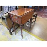 A Regency mahogany dropleaf Work Table with two drawers on turned legs and casters, 2ft 5in open