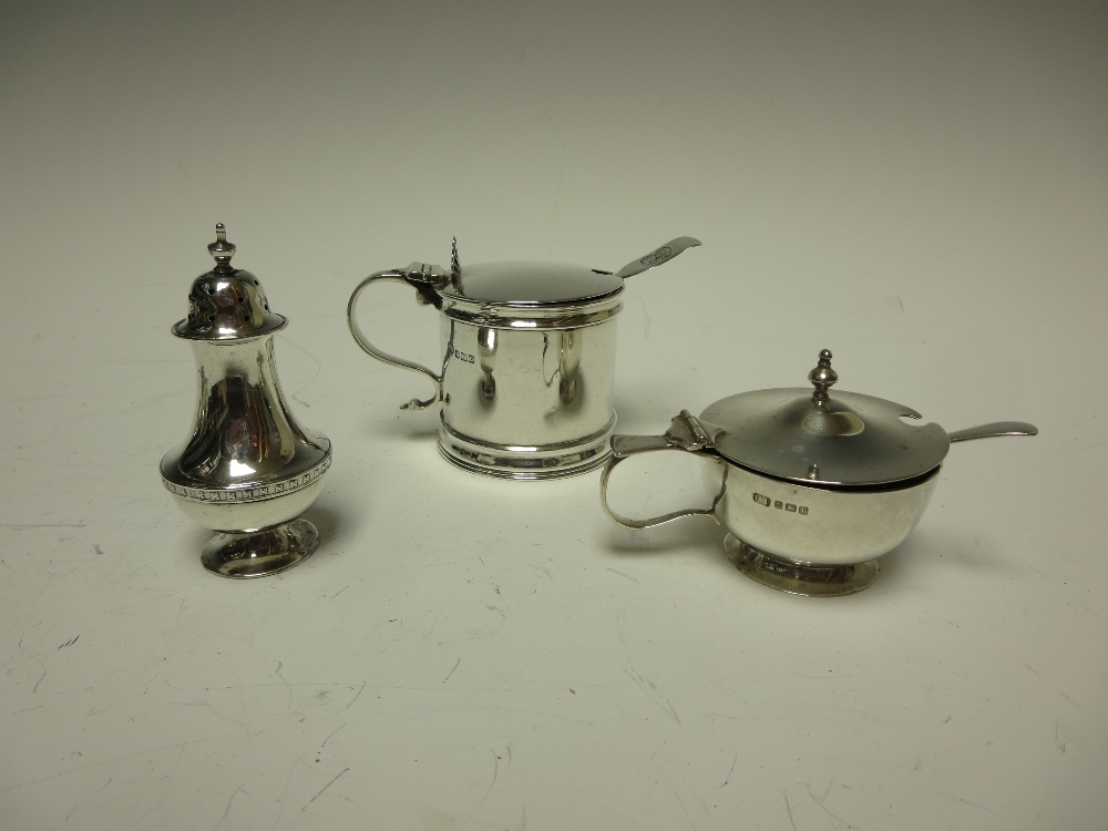 A George V heavy silver Drum Mustard Pot, Sheffield 1912, another Mustard Pot and a Pepperette