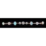 An early 20th Century Diamond and Opal Bar Brooch claw-set five old-cut diamonds and four oval